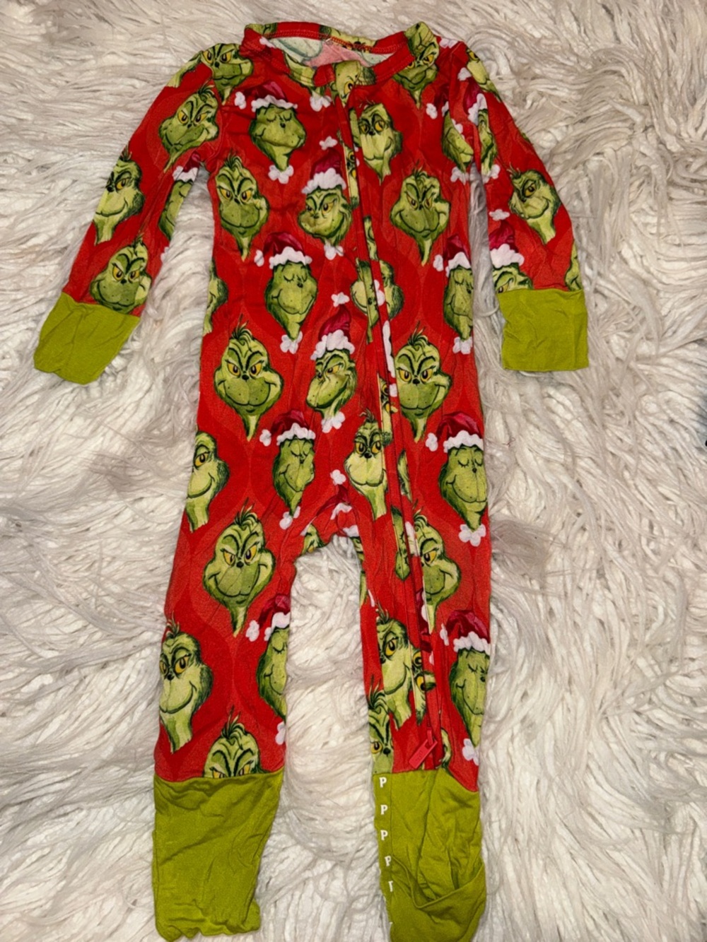 Posh Peanut Red and Green Grinch Print Footed One-Piece